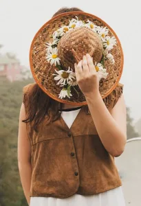 Women-in-brown-jacket-with-hat-hiding-face
