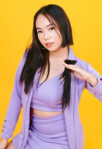 Woman-in-purple-dress-chopping-her-own-hair