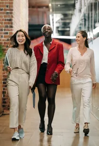 3 women walking happily