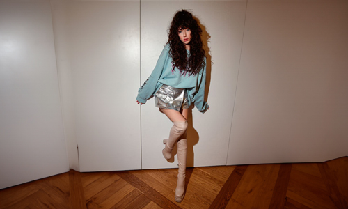 Woman wearing silver color miniskirt