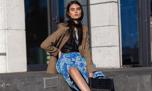 Woman-wearing-blue-floral-skirt-and-blazer
