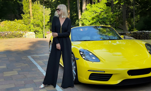 Woman-standing-near-yellow-car