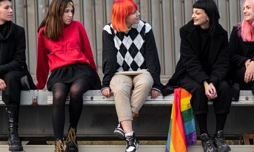 Group-of-people-sitting-with-flag