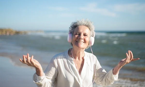 Woman wearing white headphones