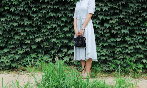 Woman with black handbag