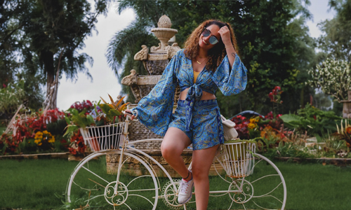 Woman standing near bicycle