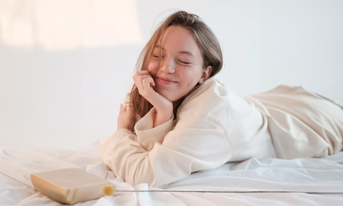 Woman waking up in a happy mood