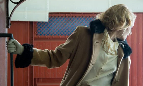 woman wearing ruffled collar dress