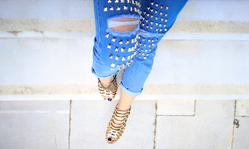 woman wearing gold slides