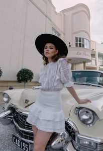 women-wearing-white-dress-and-black-hat