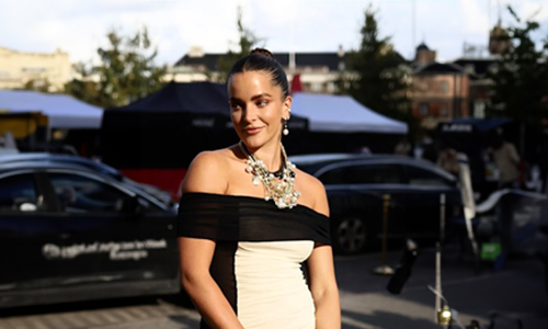 Black and cream dress with big necklace