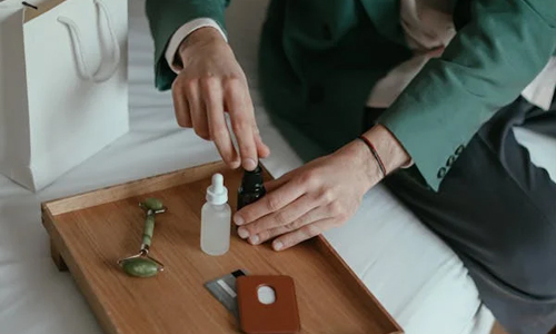 man-using-skincare-products