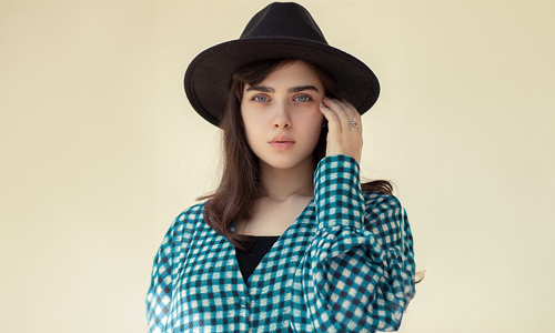 Woman wearing a black hat