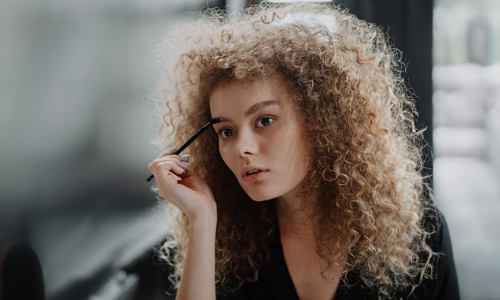 Women brushing her brows