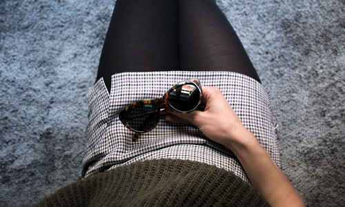 Person-holding-sunglasses