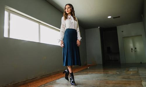 Woman-in-blue-pleated-skirt