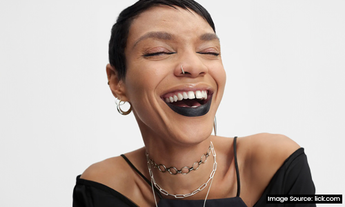 Woman-wearing-black-lipstick-on-lower-lip