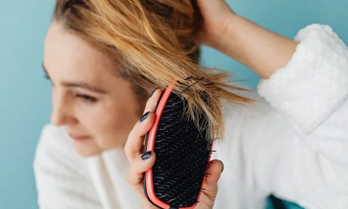 Woman brushing her hair