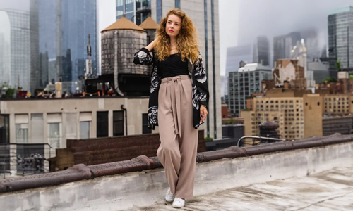 Woman-wearing-black-t-shirt-and-beige-pants