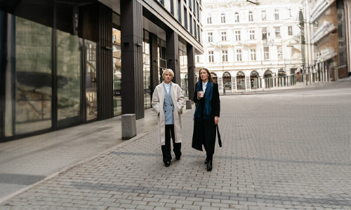 Women wearing statement coats