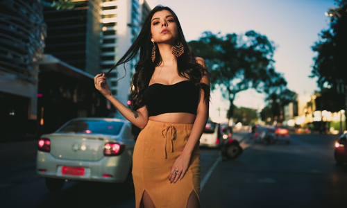 Women-wearing-tan-skirt-and-big-earrings