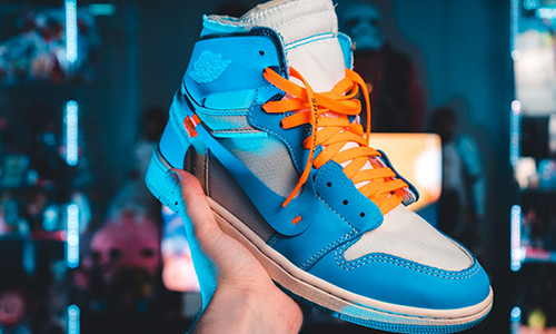 Person-holding-nike-shoe