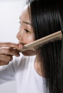 Woman-combing-her-hair
