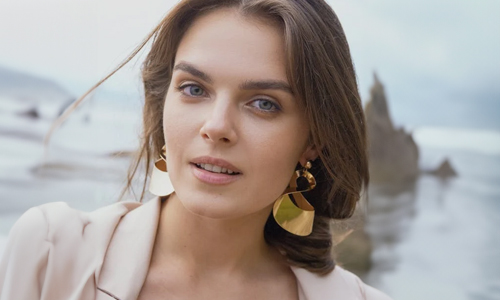 Woman wearing golden earring