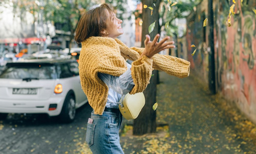 Women-wearing-yellow-knit-sweater