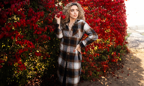 Women-standing-near-red-tree