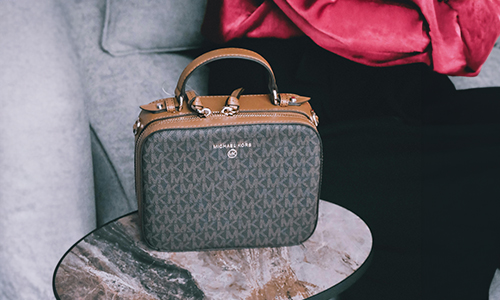 Woman-sitting-near-a-handbag