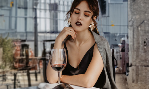 women sitting with a drink