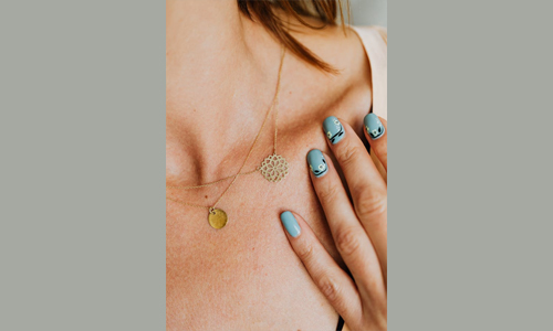 Woman wearing gold jewelry