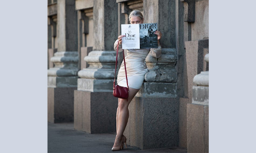 Woman with dior magazine