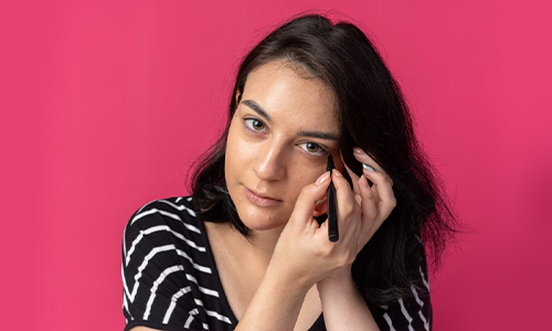 Woman wearing smudged eyeliner