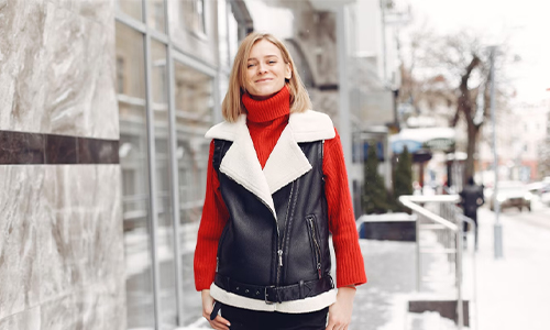 Woman in a black jacket layered over casual clothes, capturing the effortless style