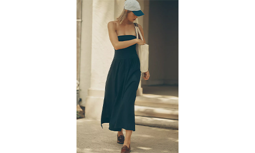 Woman confidently wearing a stylish twofer dress.