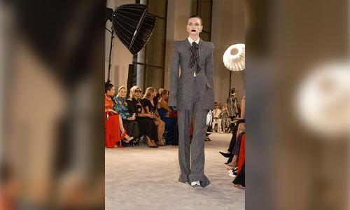 A floor-length black column gown