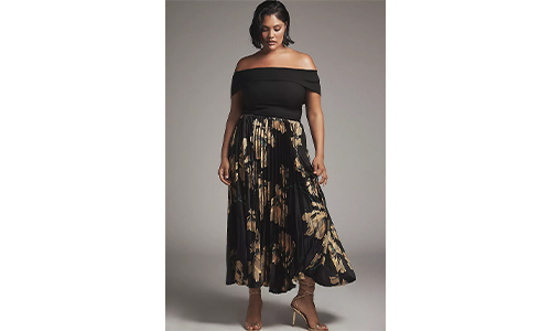 Model wearing a flowy, patterned twofer dress, representing a fresh fashion trend.