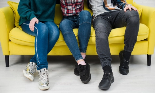 Group of young people showing different casual footwear styles