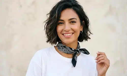 Woman wearing a cotton bandana tied neatly around her neck