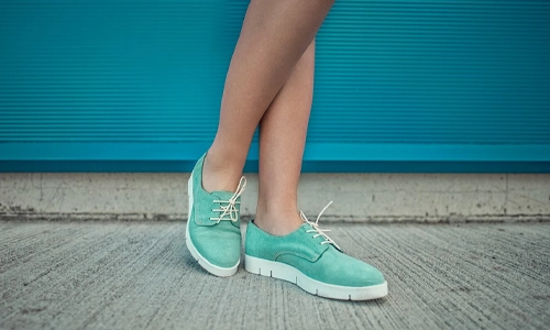 Girl wearing trendy shoes. Shoes close up shoot for fashion store