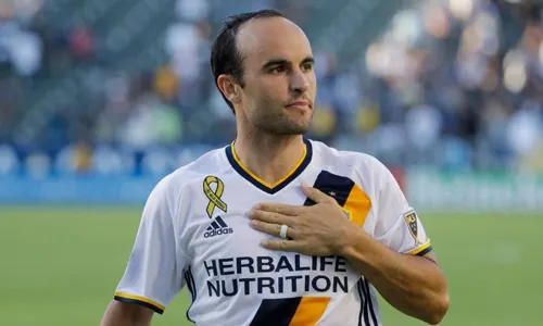 Landon Donovan attending a sporting event showcasing a modern and well-groomed appearance