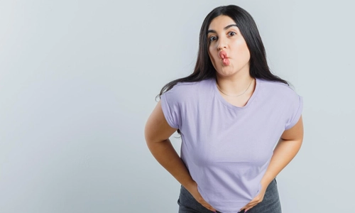 image of woman wearing pants below or above the belly