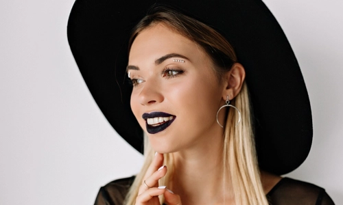 Glossy black lips with minimal makeup